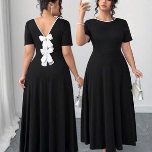 Elegant Black Dress with White Bow Accents